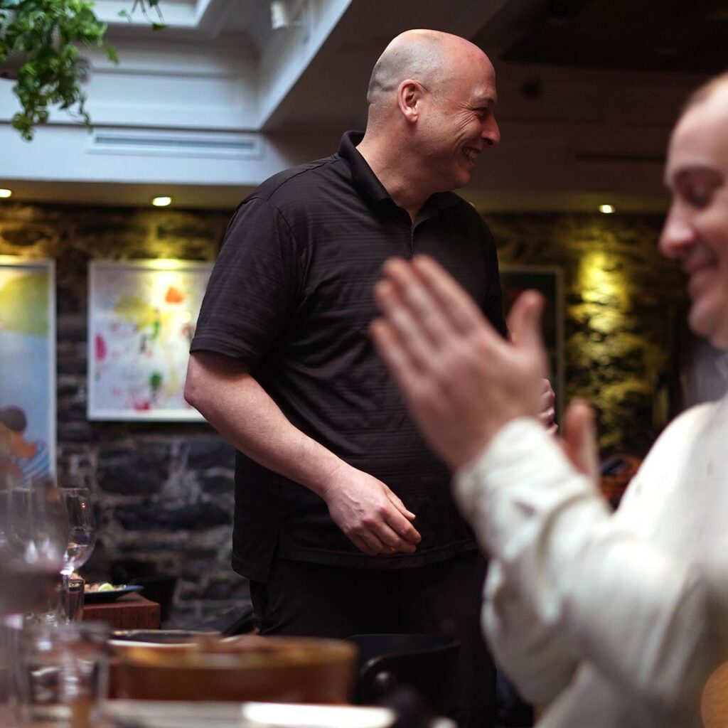Waiter gets an applause at Restaurant le Polisson in Old Montreal